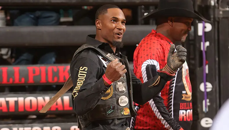 Teaspoon Mitchell proud to cowboy protect for his son Ouncie at the Bill Pickett Invitational 